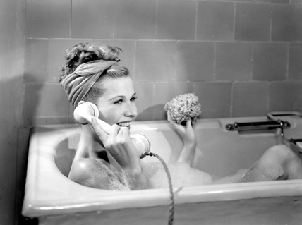 woman on the phone in the bath