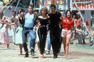 Sandy and the cast of Grease