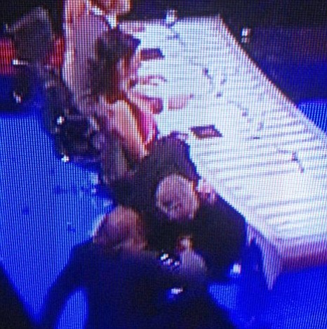 X Factor 2012 producer whispers in Louis' ear
