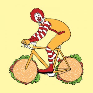 Ronald McDonald riding a bike with hamburger wheels